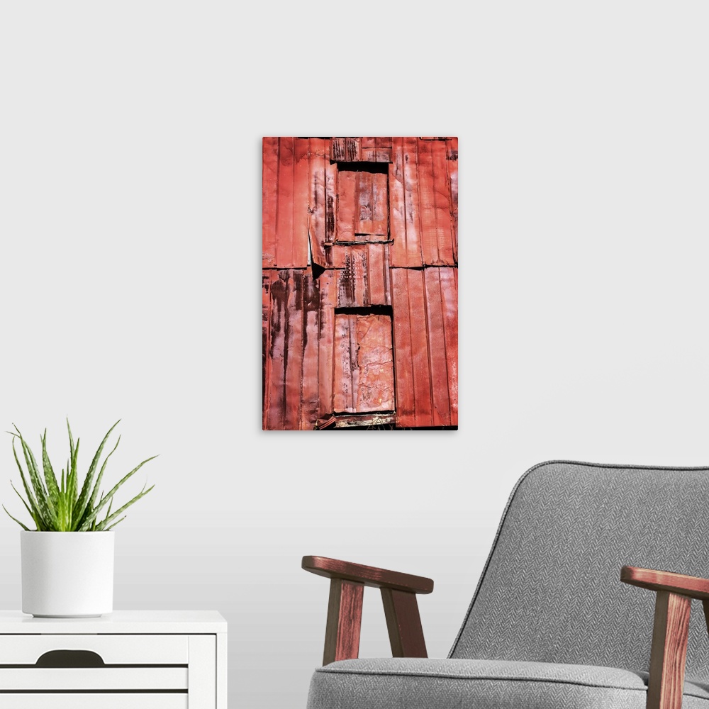A modern room featuring Photograph of a weathered farm building, taking up the whole frame.