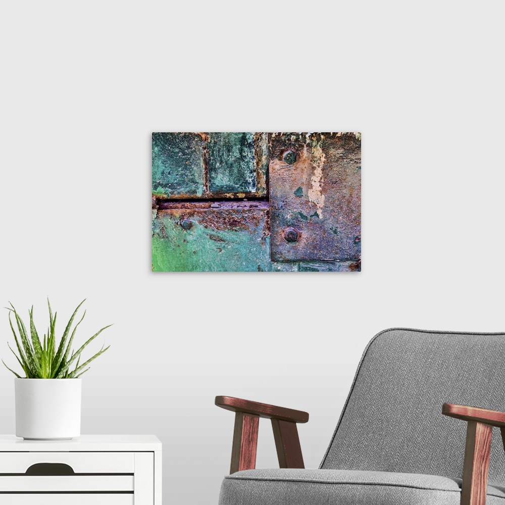 A modern room featuring A close up photo of weathered metal elements, creating an abstract image.