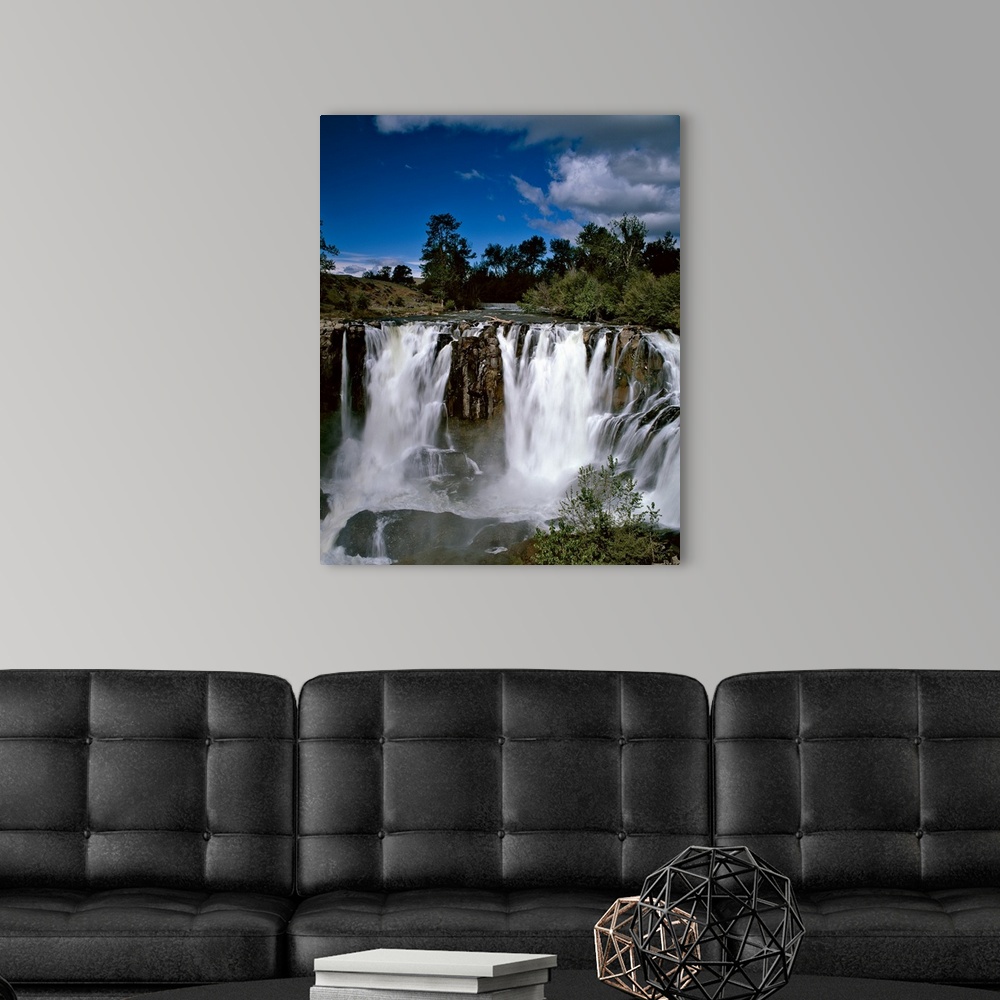 A modern room featuring Landscape phonograph with rushing waterfalls on a clear day.