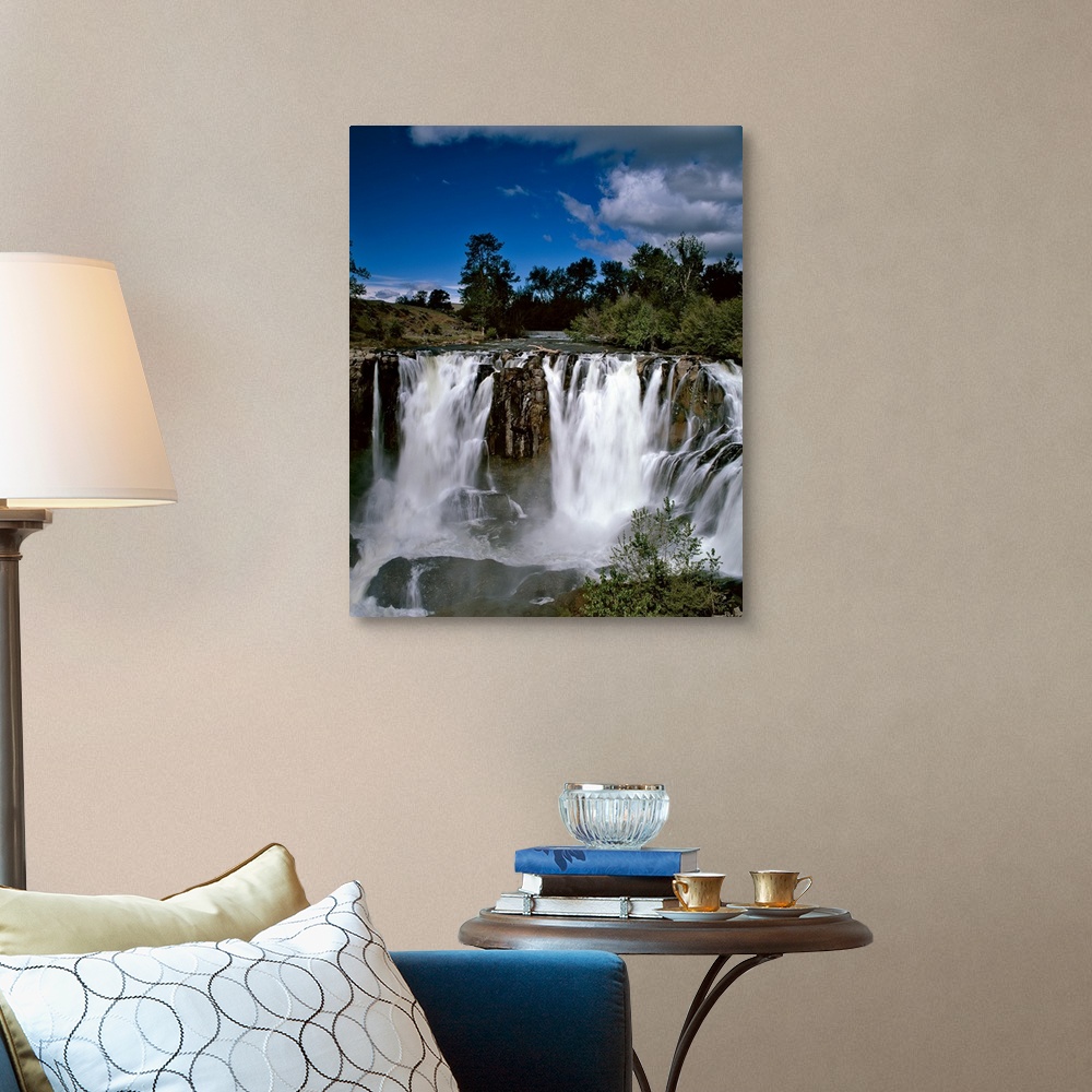 A traditional room featuring Landscape phonograph with rushing waterfalls on a clear day.