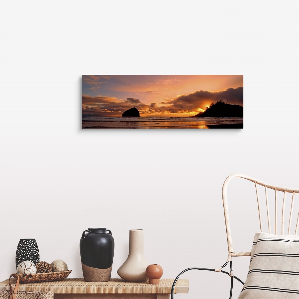 A farmhouse room featuring Sea stacks on the beach silhouetted at sunset, Pacific City, Oregon.
