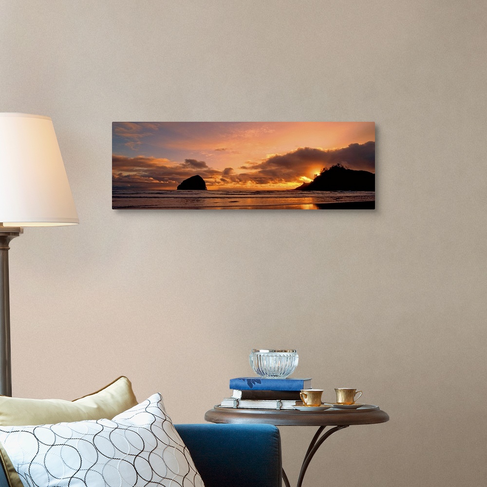 A traditional room featuring Sea stacks on the beach silhouetted at sunset, Pacific City, Oregon.