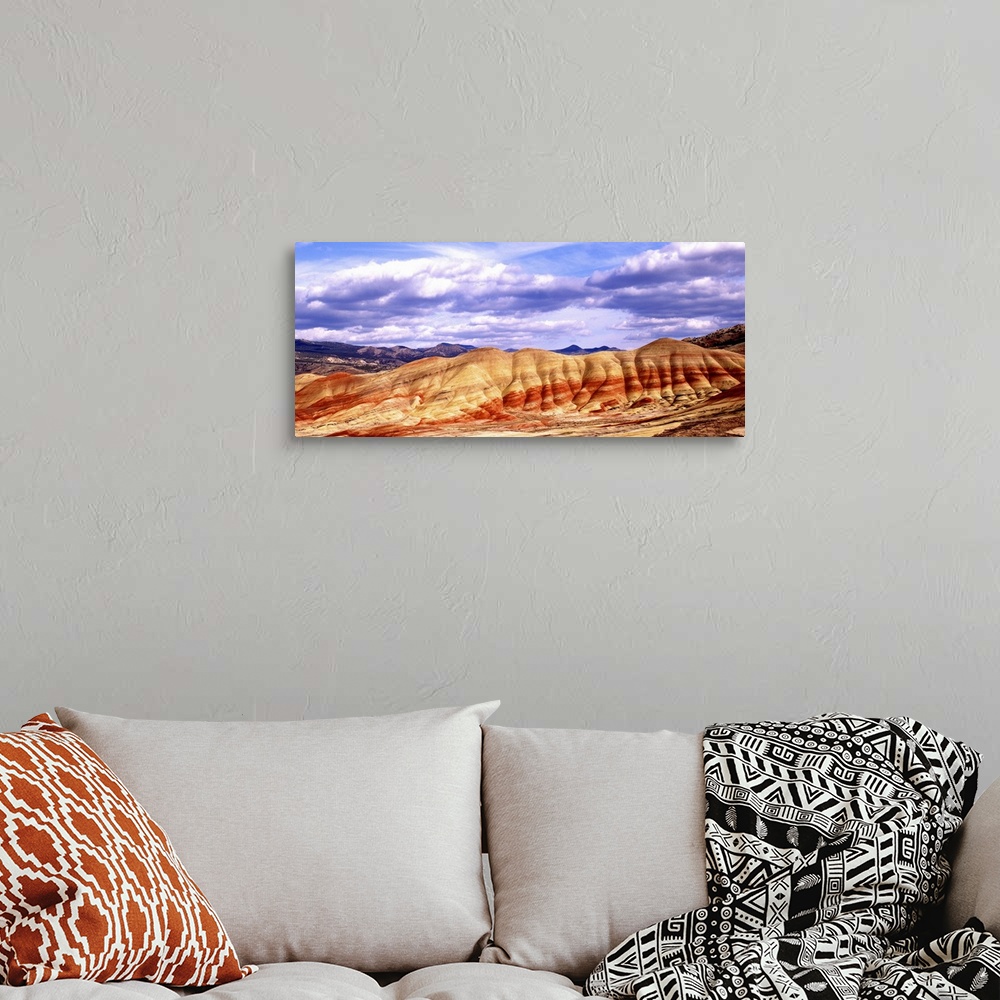 A bohemian room featuring Large white clouds over the Painted Hills in Oregon.
