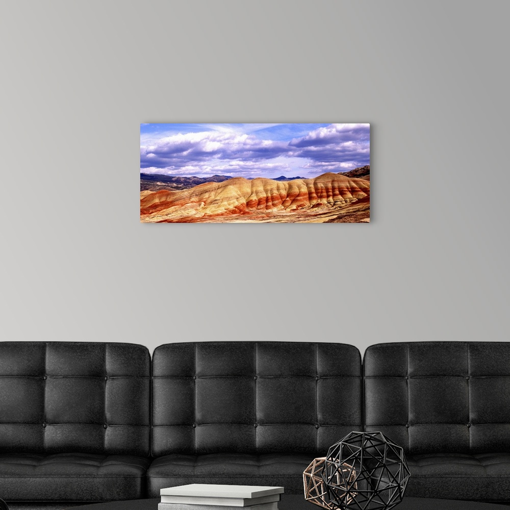 A modern room featuring Large white clouds over the Painted Hills in Oregon.