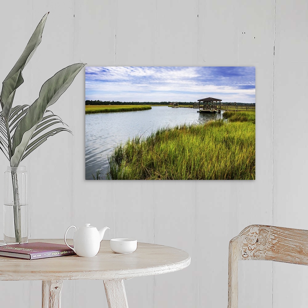A farmhouse room featuring A gazebo overlooking the water in a marsh.