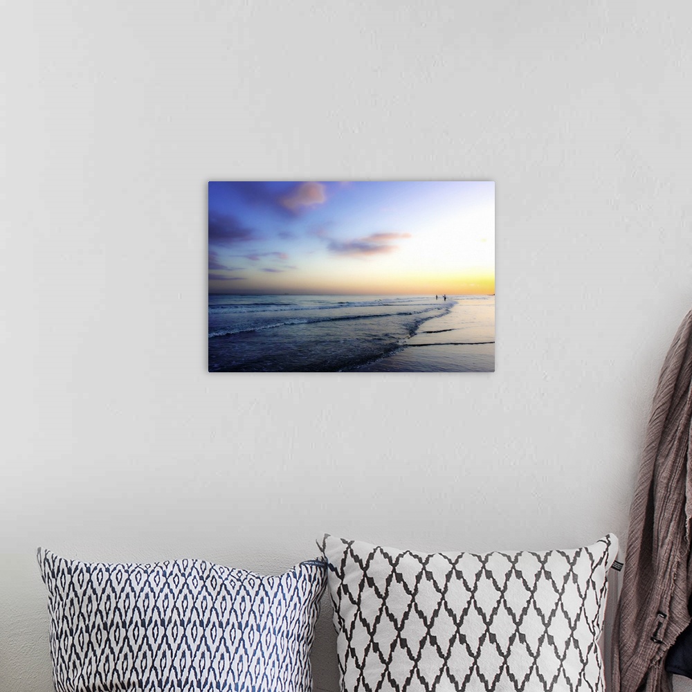 A bohemian room featuring Pastel-colored sky over the ocean at dawn.