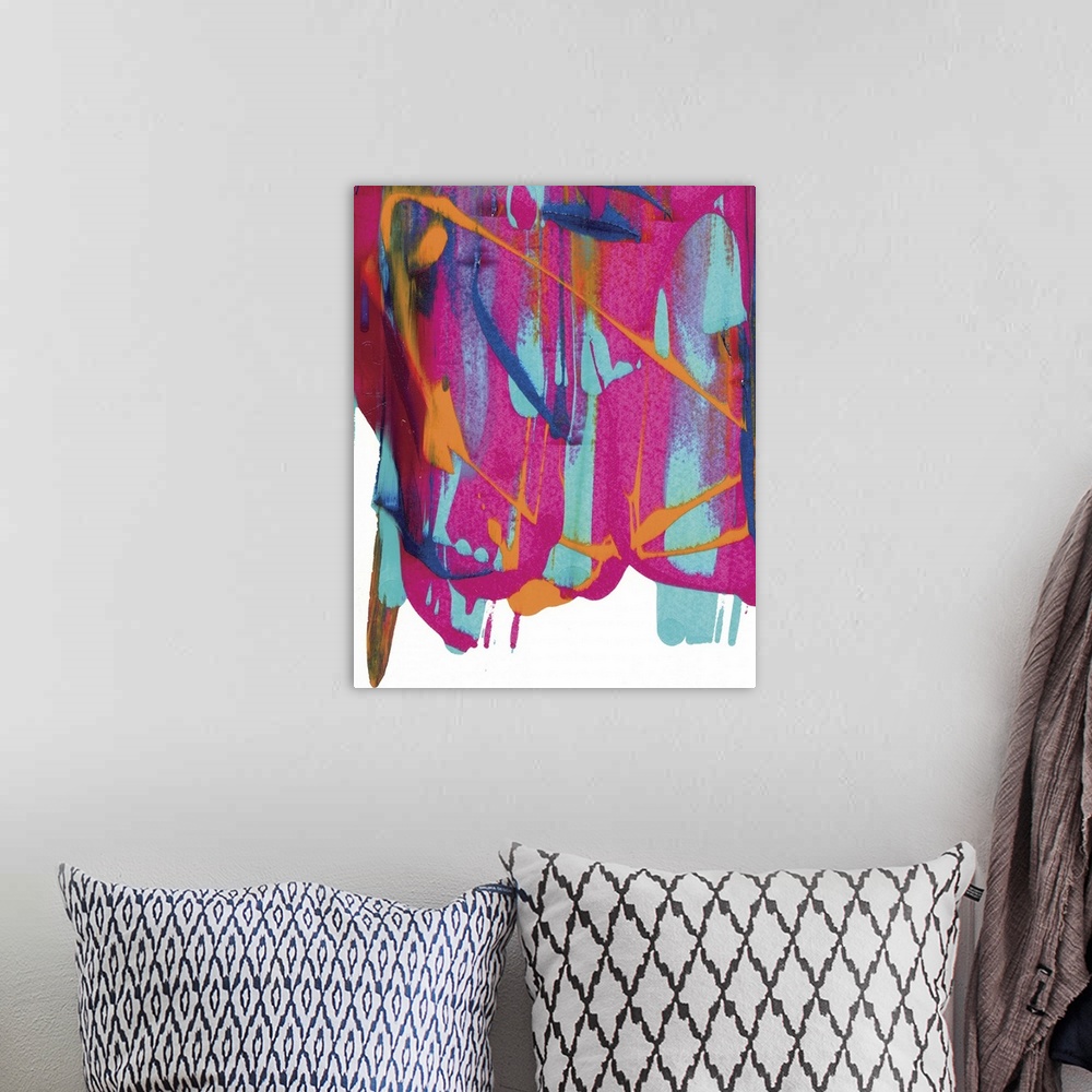 A bohemian room featuring Brightly colored abstract painting with pink, blue, and orange hues falling from the top down to ...