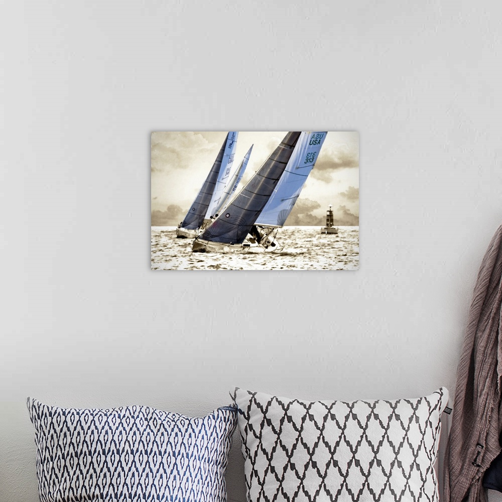 A bohemian room featuring Artistic rendering photograph of two racing sailboats.