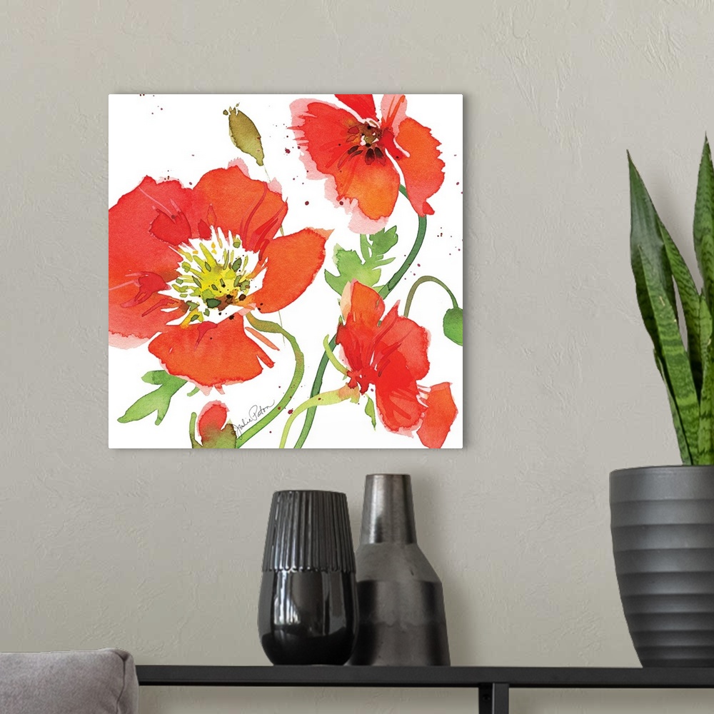 A modern room featuring Square watercolor painting of red poppies on a white background with a little bit of red paint sp...