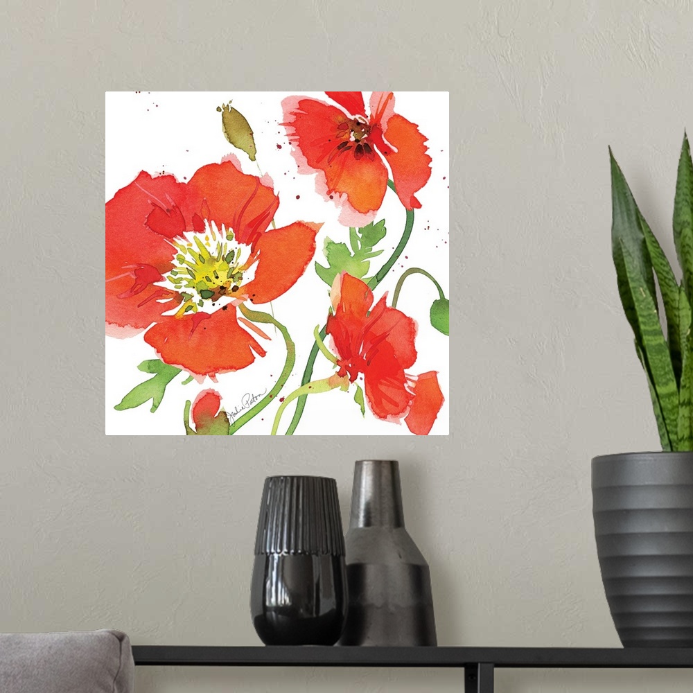 A modern room featuring Square watercolor painting of red poppies on a white background with a little bit of red paint sp...