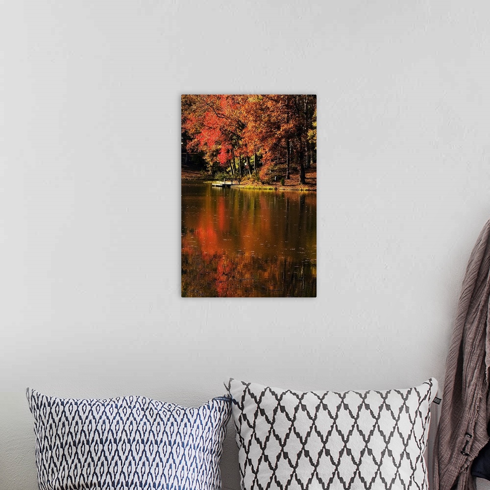 A bohemian room featuring Vertical photo on canvas of a lake with a dock and fall foliage surrounding it.