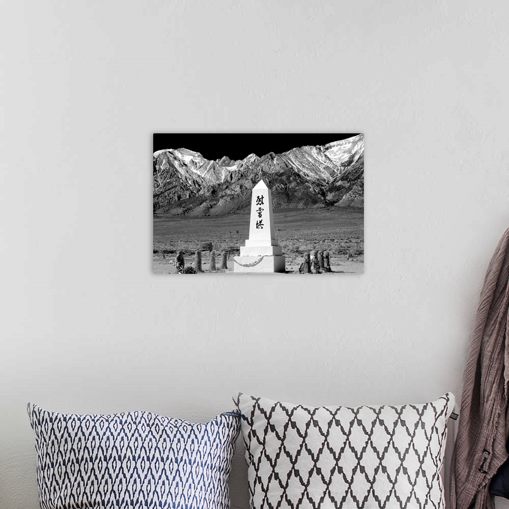 A bohemian room featuring Black and white photograph with a WWII monument in front of the Sierra Nevada mountain range.