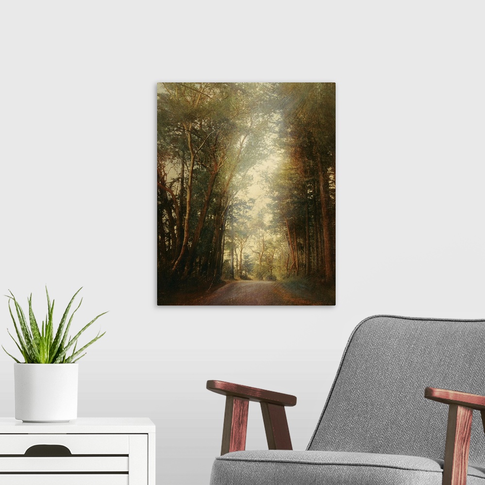 A modern room featuring Classical painting of stone pathway curving through forest on a foggy day.