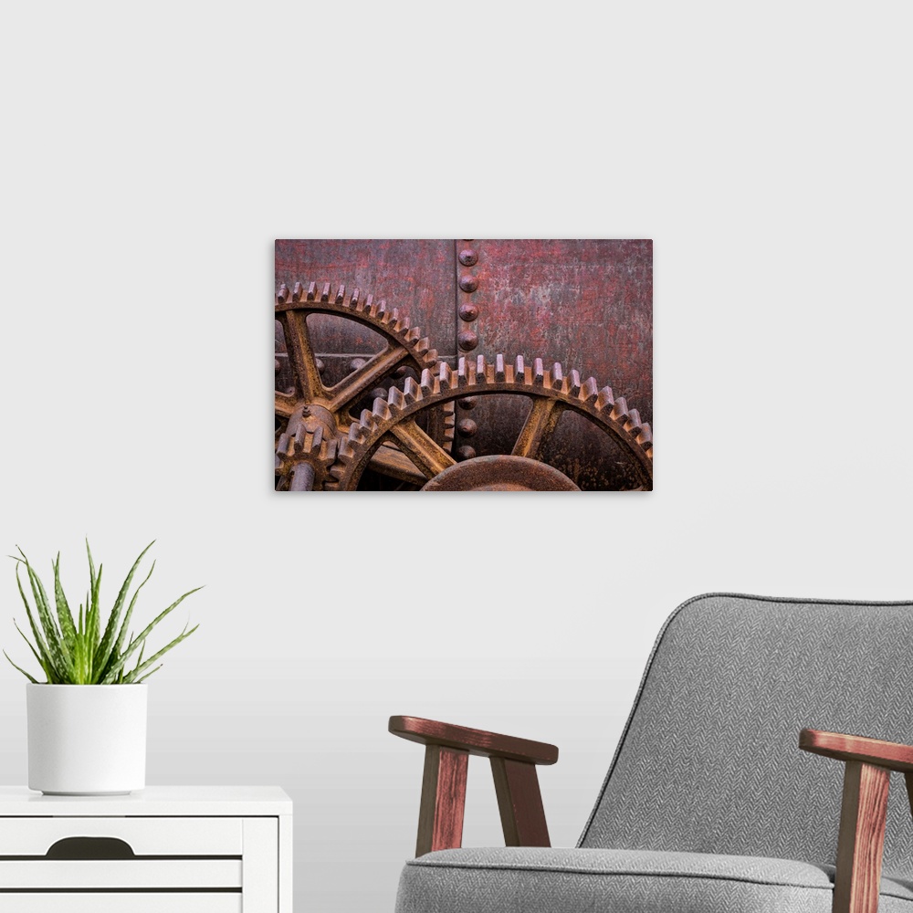 A modern room featuring A close up photo of metal elements that have rusted over time.