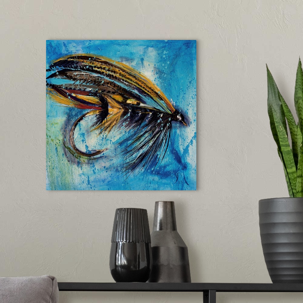 A modern room featuring Square painting of an orange, red, and black fly fishing lure on a blue and green background.