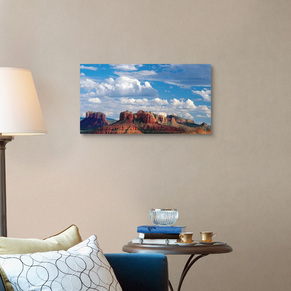 A traditional room featuring Large white clouds over the desert landscape of Sedona, Arizona.