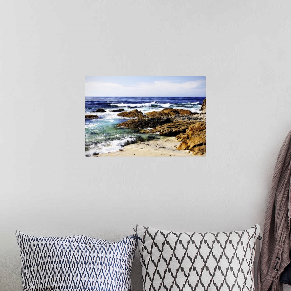 A bohemian room featuring Photograph of rocky shoreline with waves crashing in.