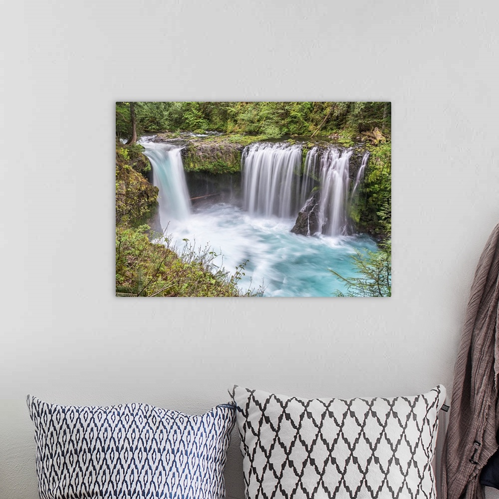 A bohemian room featuring Photograph of water rushing down Spirit Falls in Washington.