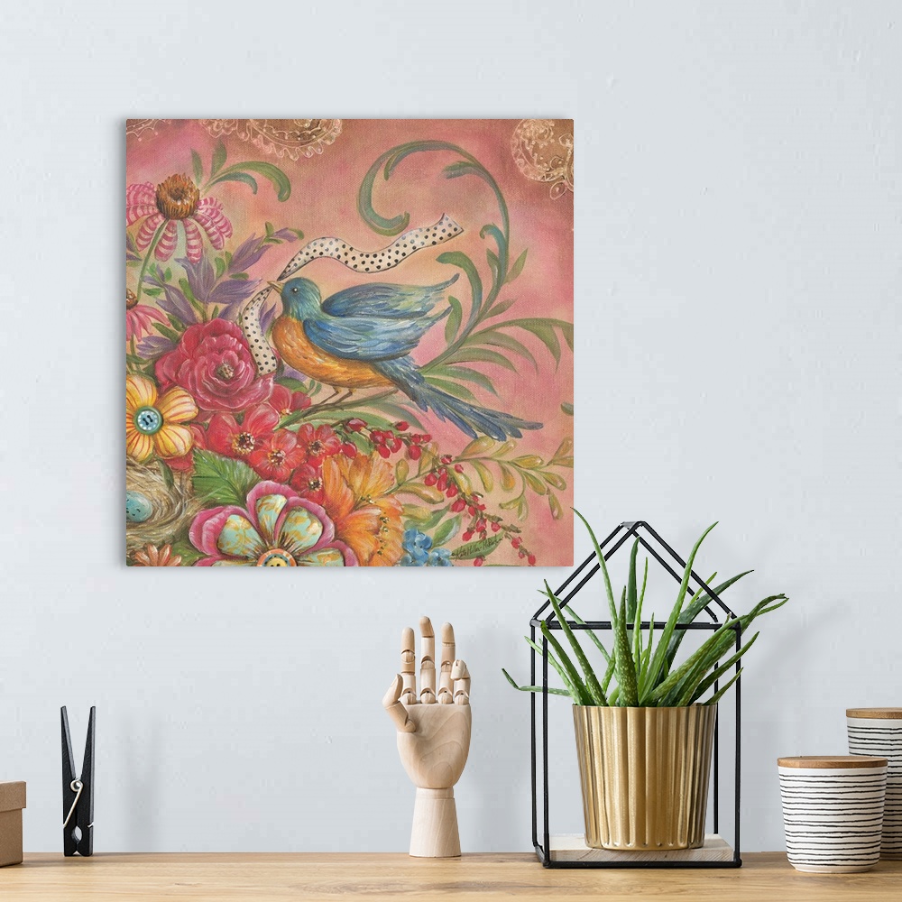 A bohemian room featuring Colorful square painting of an orange and blue bird with a ribbon in its mouth on top of flowers.