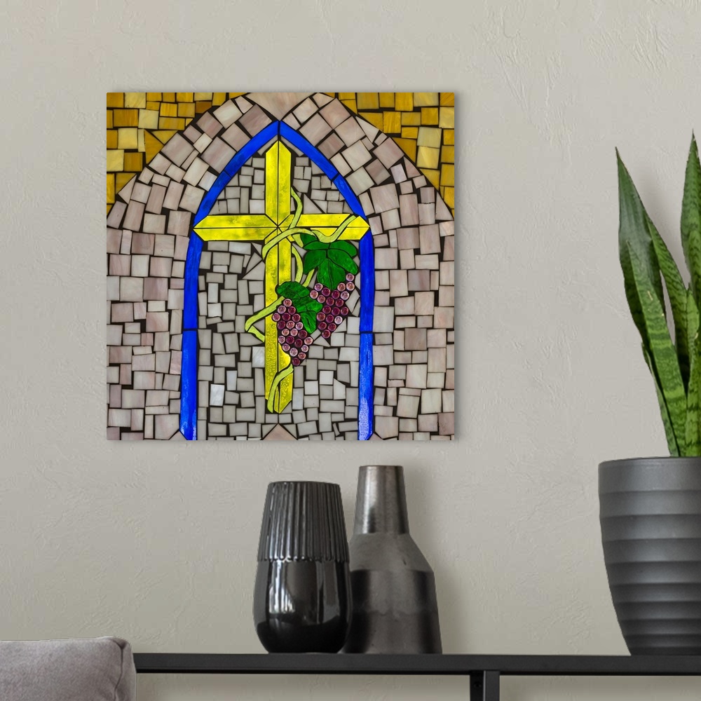 A modern room featuring Artwork done in a stained-glass style depicting a cross and wine grapes, symbols of Christianity.