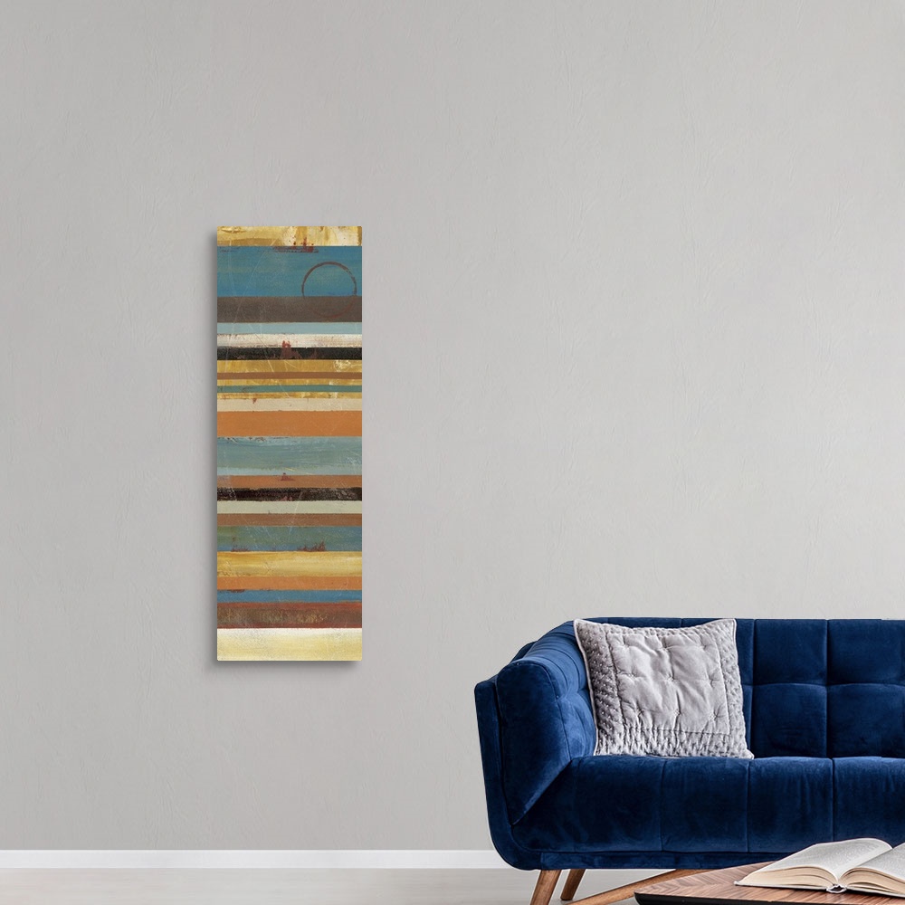 A modern room featuring A thin vertical piece with stripes of muted colors running horizontally across the print.