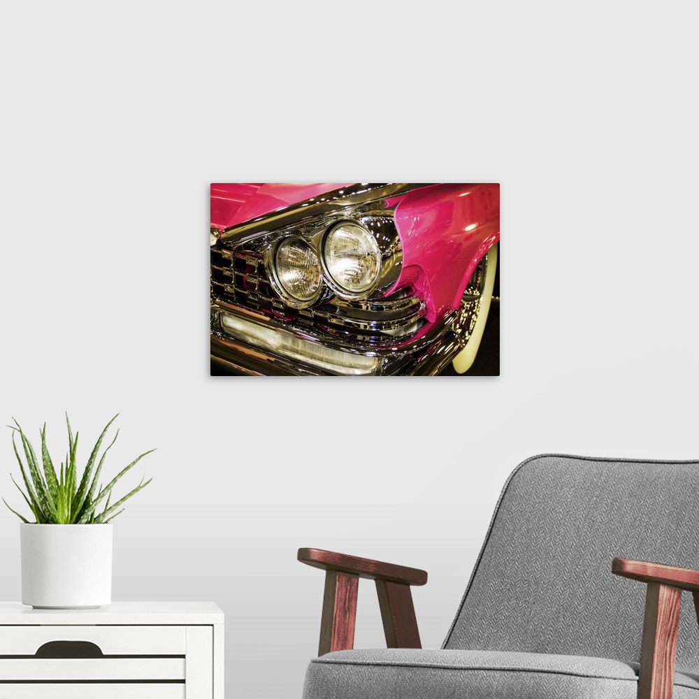 A modern room featuring Fine art photograph of the headlights of a hot pink vintage car.