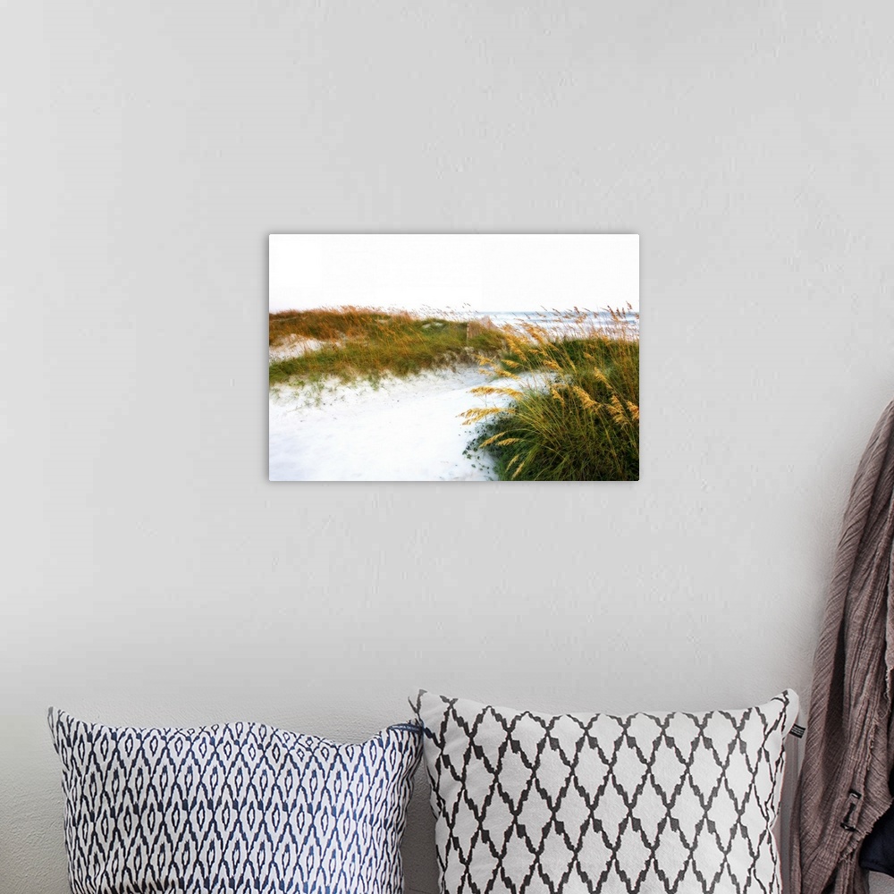 A bohemian room featuring This landscape photograph of a sandy beach and sea grass blowing in the wind that has been edited...