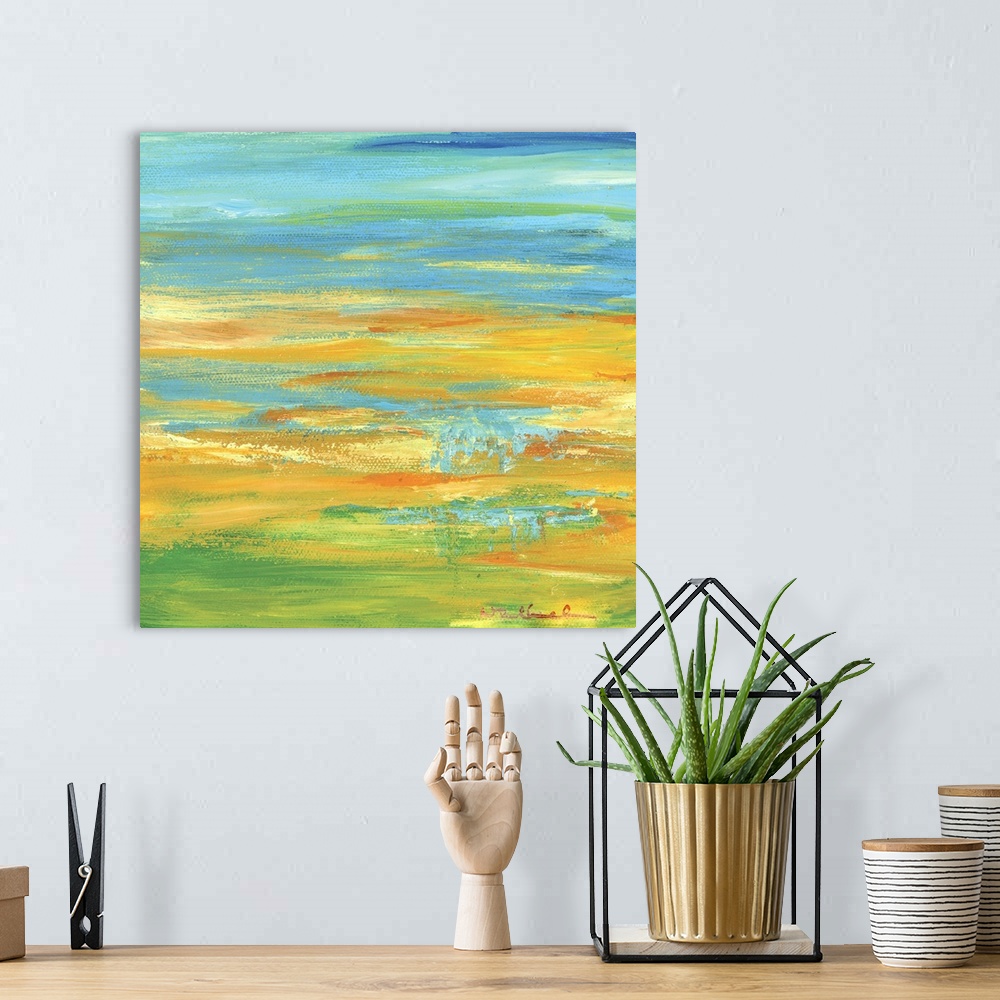 A bohemian room featuring Square abstract painting in shades of orange, yellow, green, and blue resembling a Summer landscape.