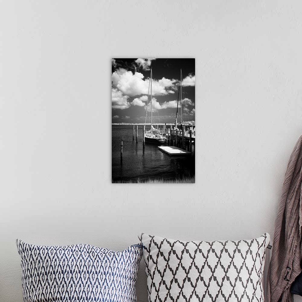 A bohemian room featuring Black and white photograph of docked sailboats on Taylor's Creek in Virginia.