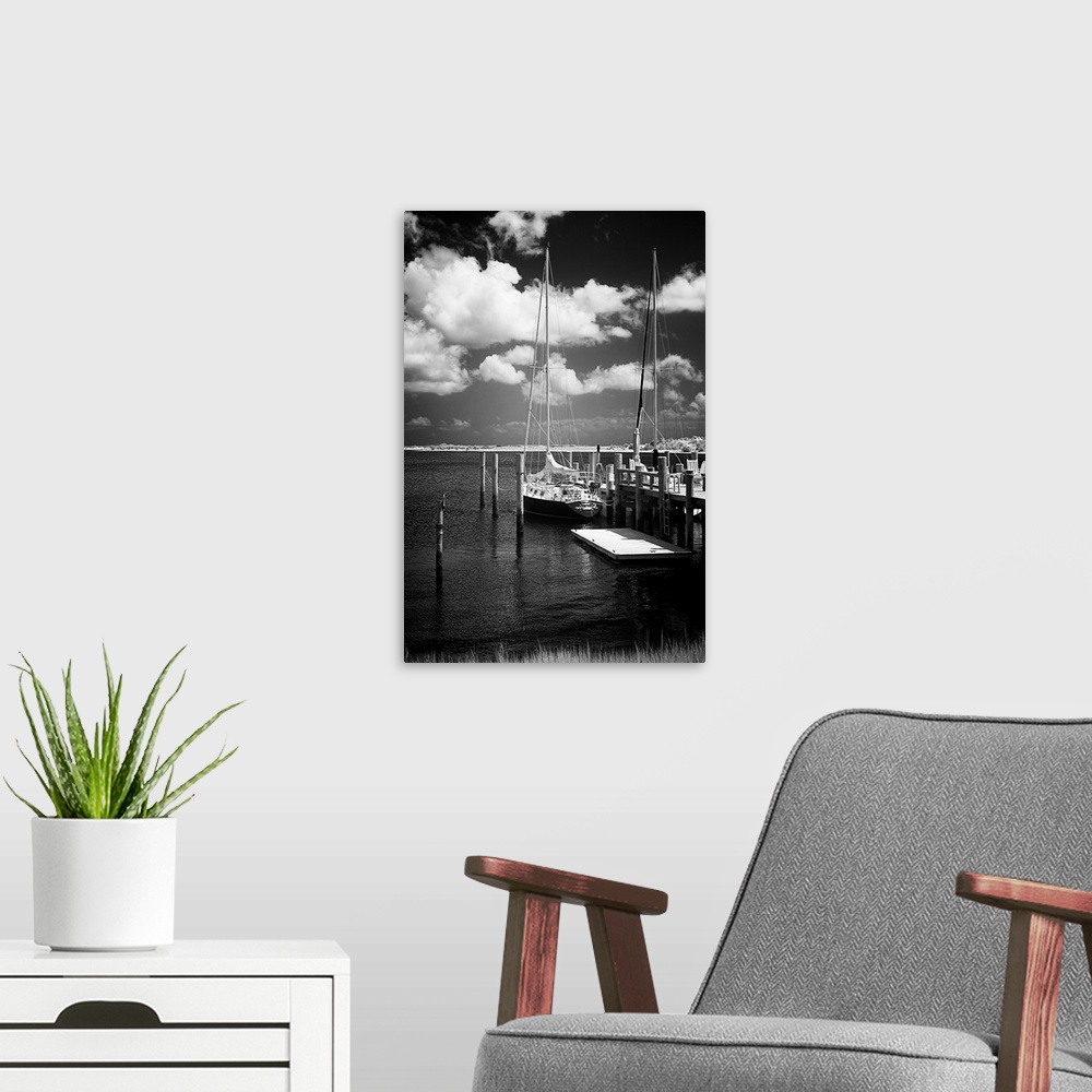A modern room featuring Black and white photograph of docked sailboats on Taylor's Creek in Virginia.