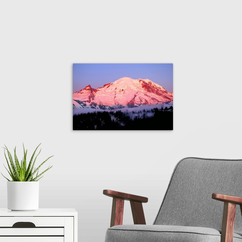 A modern room featuring Photograph of Mount Rainier at sunrise with the pink sky reflecting onto the snowy peaks.