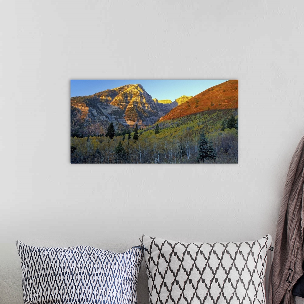 A bohemian room featuring Light from the setting sun turning the mountains red in Utah.