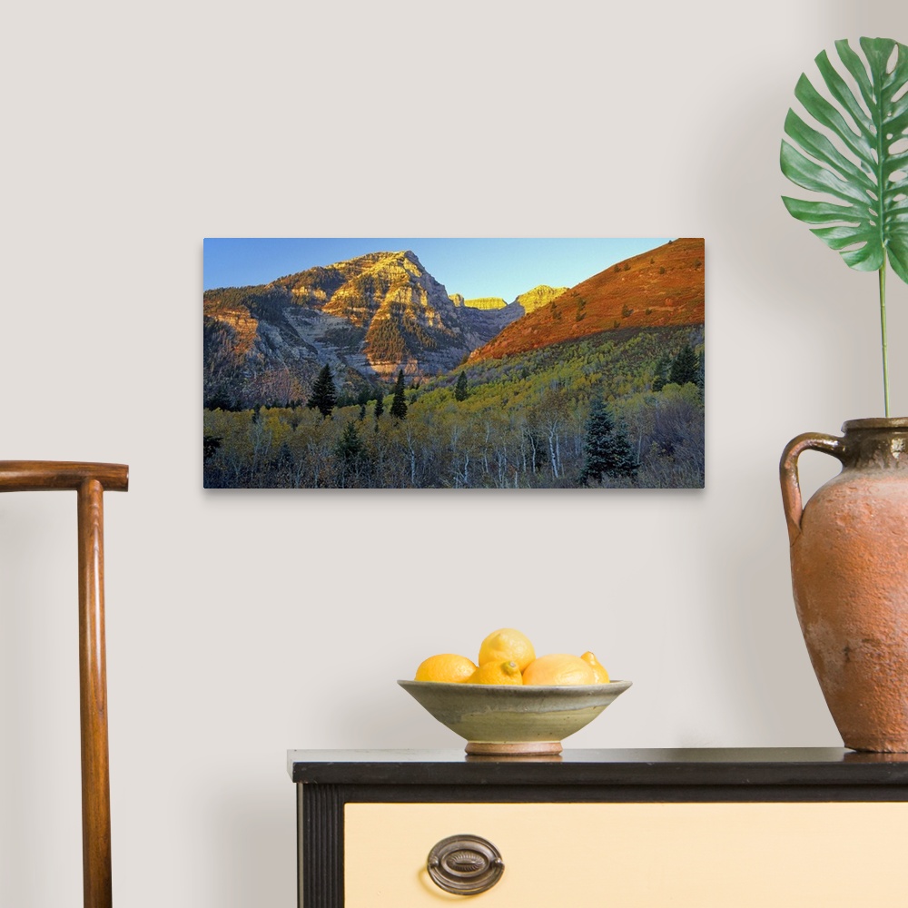 A traditional room featuring Light from the setting sun turning the mountains red in Utah.