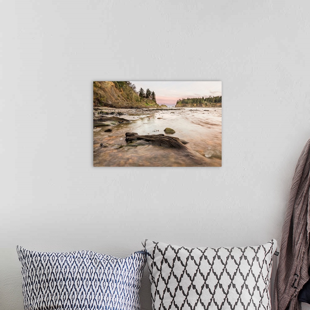 A bohemian room featuring Landscape photograph of a pink and purple sunrise over the water at Sunset Bay State Park, Oregon.
