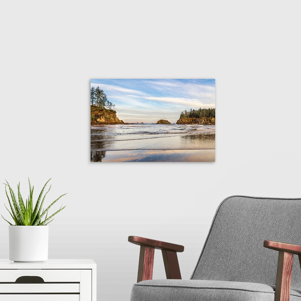 A modern room featuring Landscape photograph of the end of a sunrise over the water at Sunset Bay State Park, Oregon.