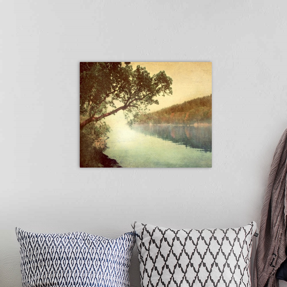 A bohemian room featuring Giant photograph displays a tree as it hangs over the quiet waters of a lake.  On the other side ...