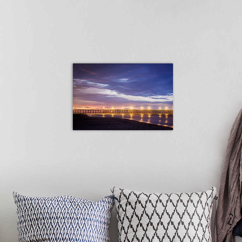 A bohemian room featuring Photograph of Surfside Pier lit up at sunrise, South Carolina.