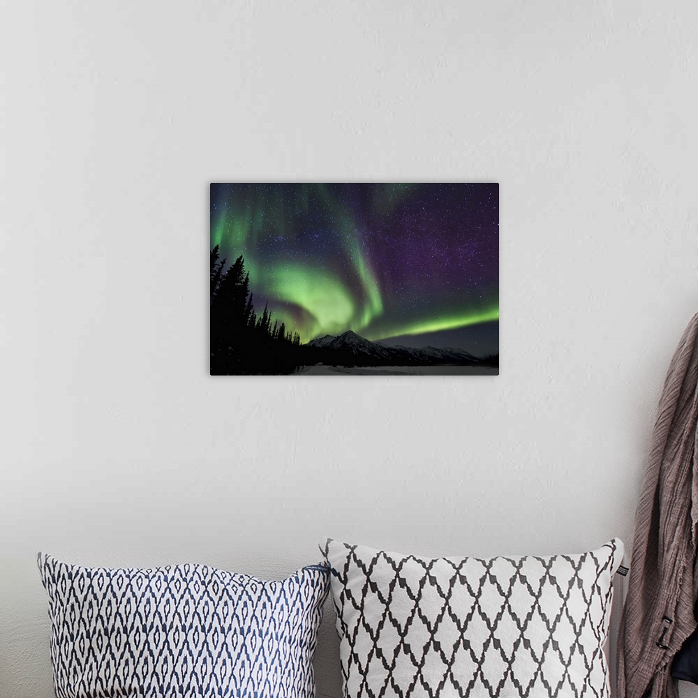 A bohemian room featuring Swirls and band of northern lights in the Brooks Range