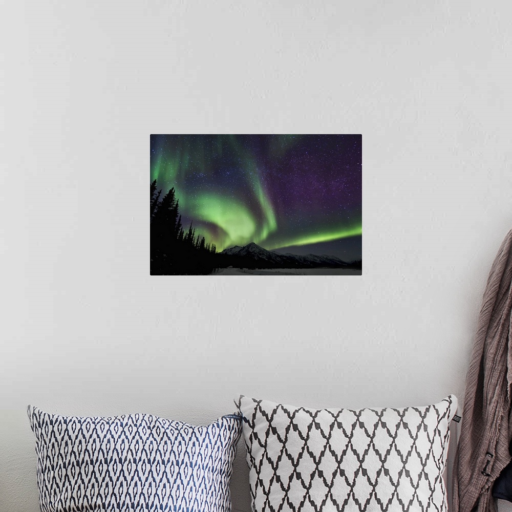 A bohemian room featuring Swirls and band of northern lights in the Brooks Range