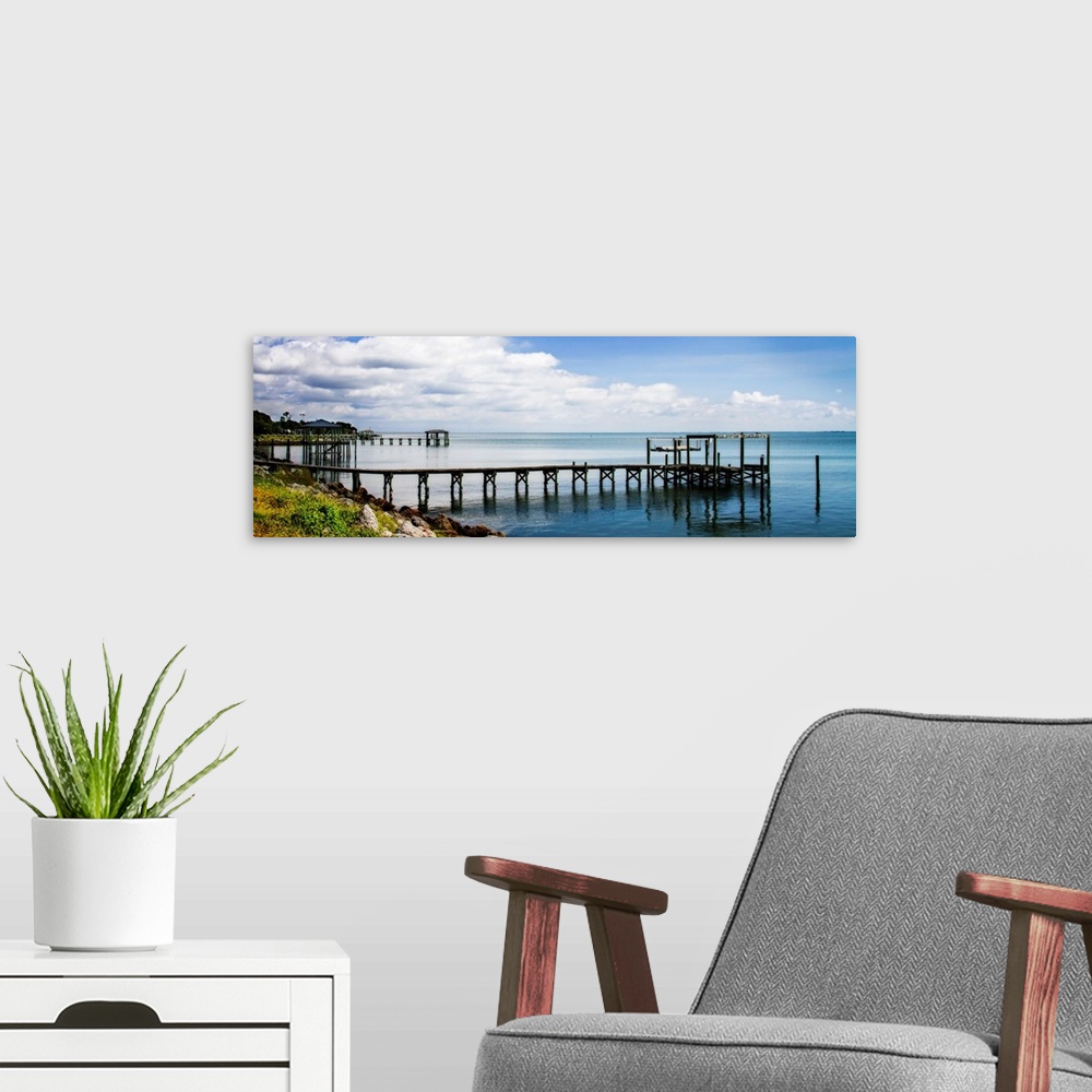 A modern room featuring Panoramic photograph of a dock stretched out over the Thorofare Bay in North Carolina.