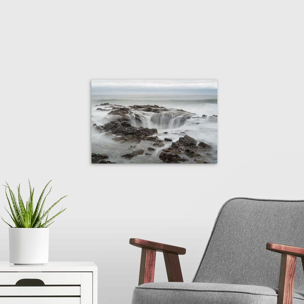 A modern room featuring Long exposure photograph of Thor's Well in Oregon.