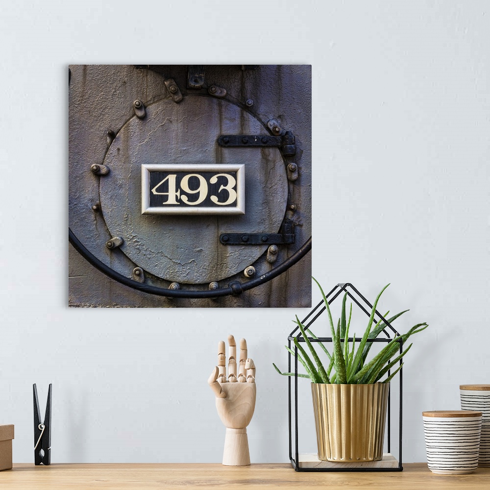 A bohemian room featuring Photograph of weathered detail from a vintage train locomotive.