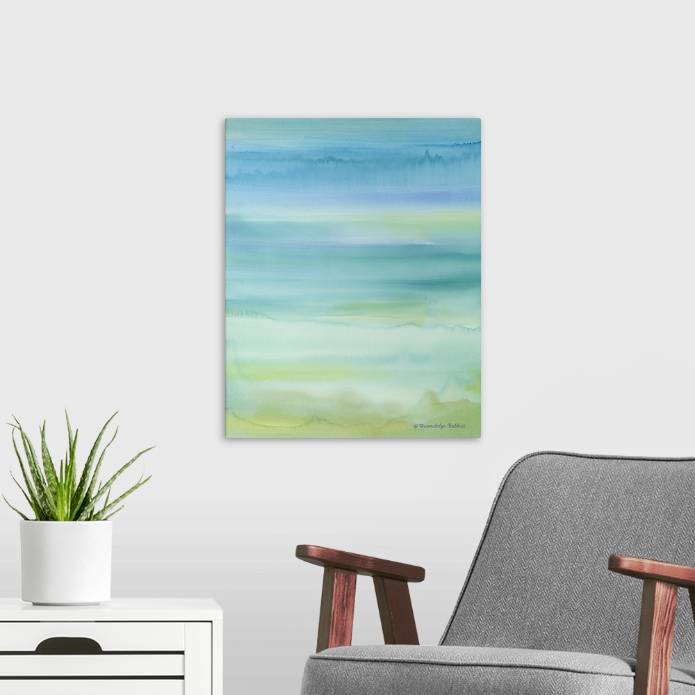 A modern room featuring Abstract watercolor painting in tranquil blue, green, and yellow hues.