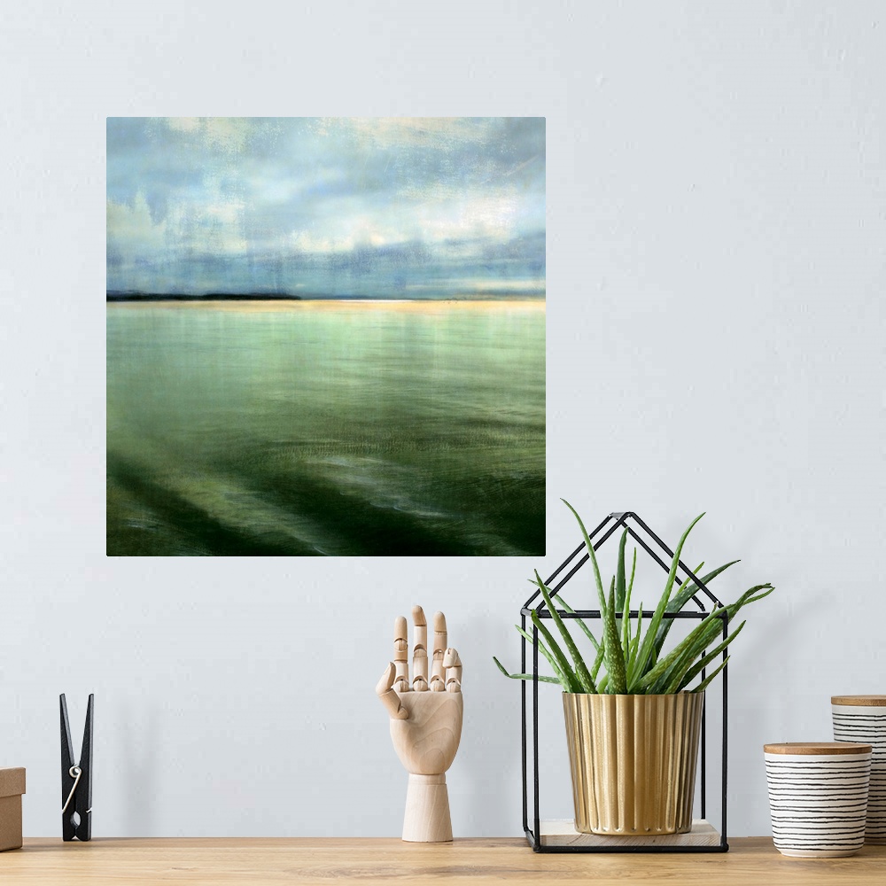 A bohemian room featuring Big square canvas art shows calm waters in the foreground slowly hitting the beach in the backgro...