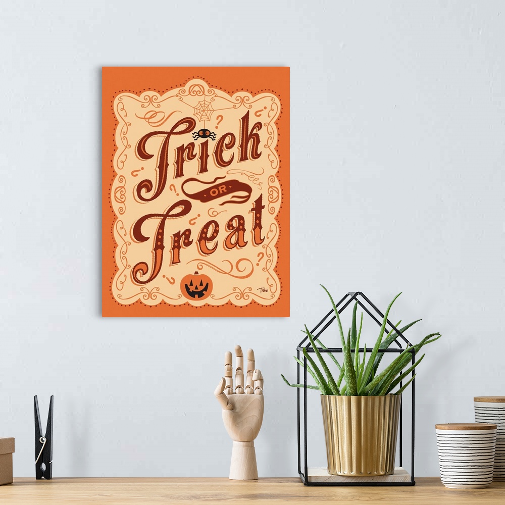 A bohemian room featuring Trick or Treat Sign in orange and brown.