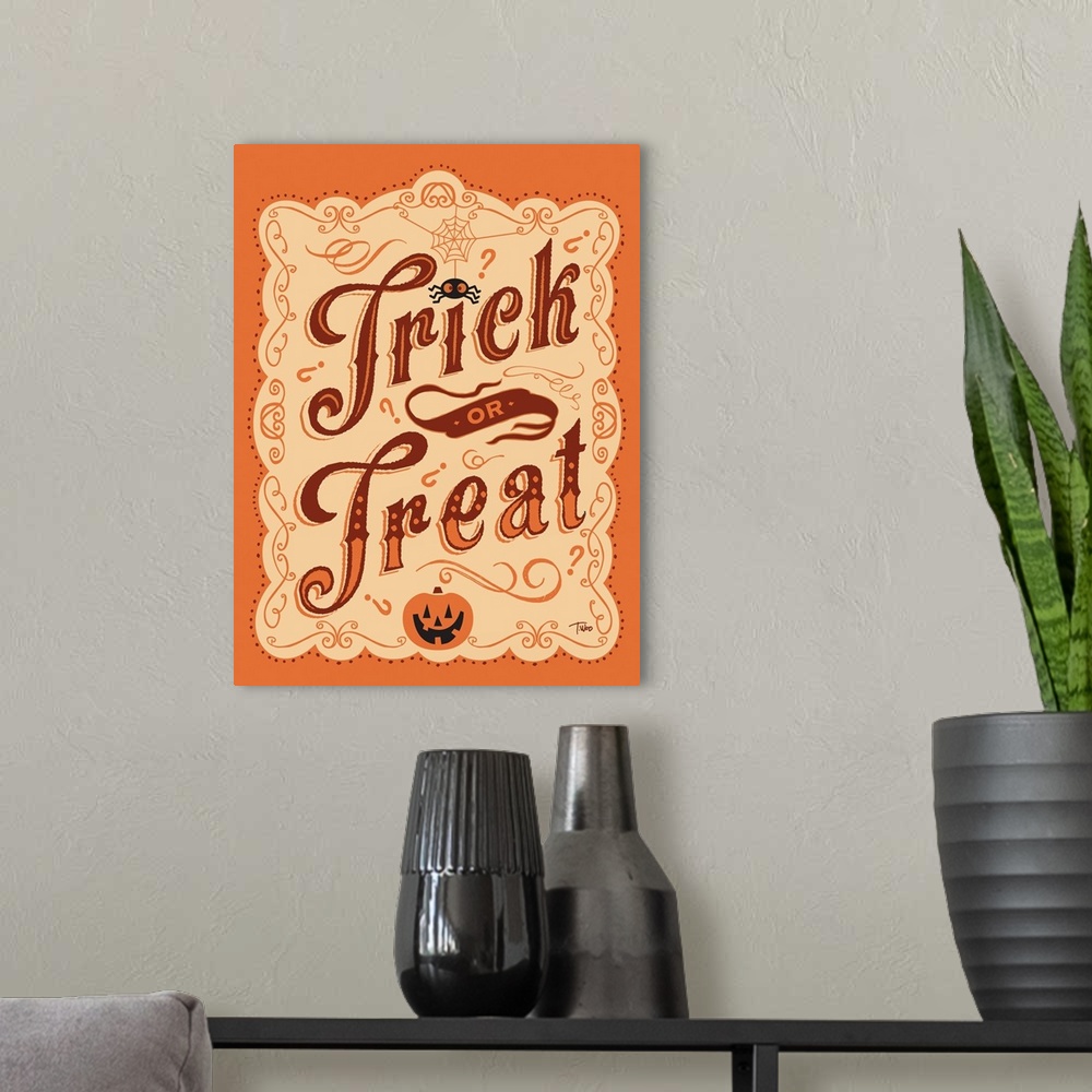 A modern room featuring Trick or Treat Sign in orange and brown.