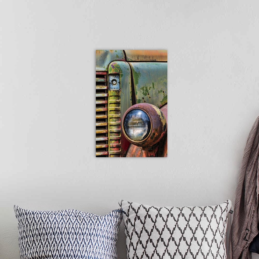 A bohemian room featuring A close up photo of weathered old parts of a vintage truck.