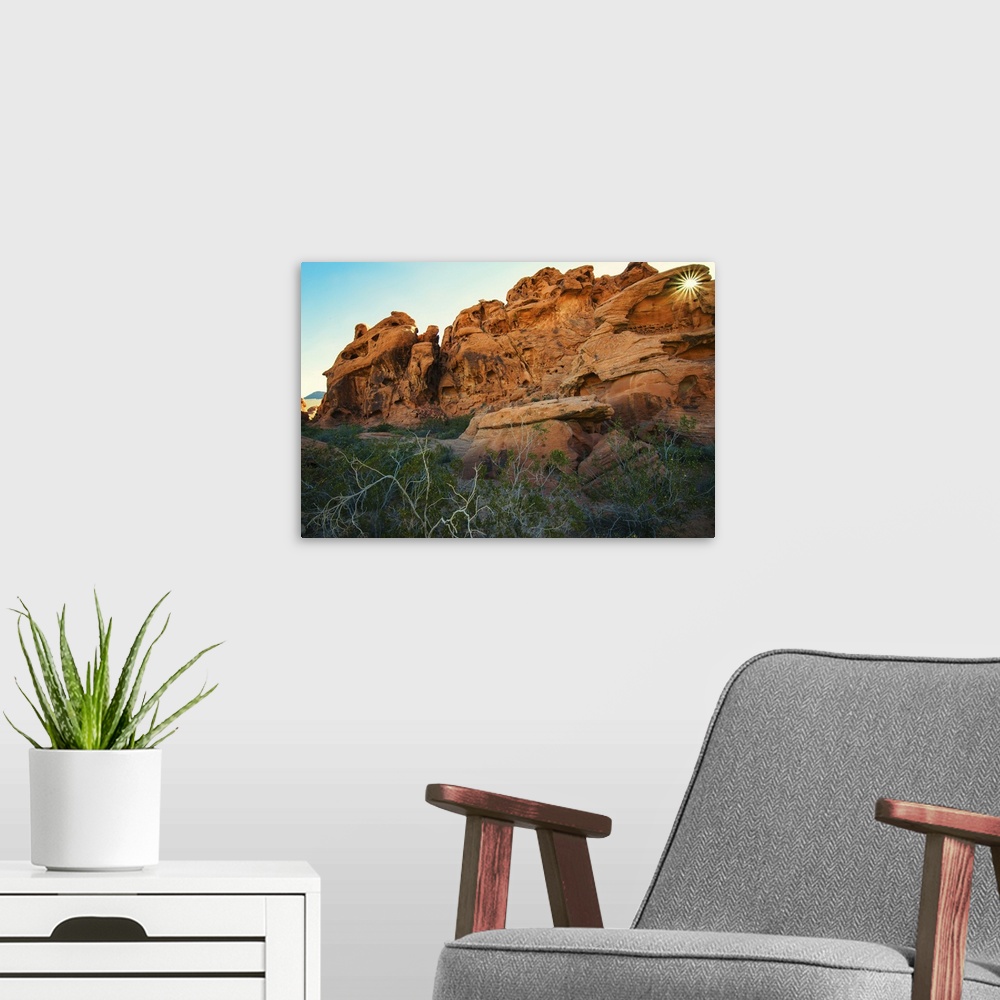 A modern room featuring Landscape photograph of sandstone rock formations with the sun shining through an arch at Valley ...