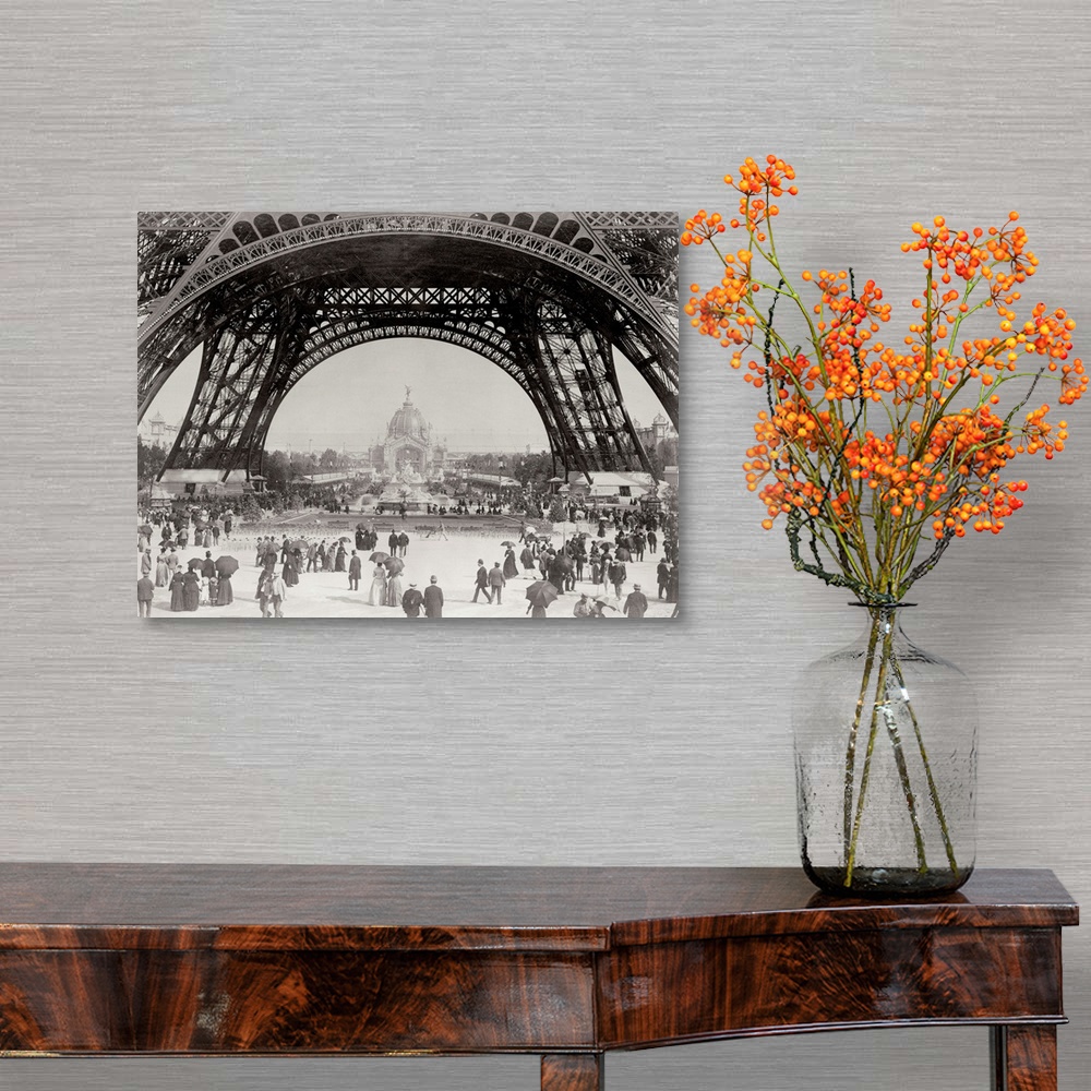 A traditional room featuring Vintage photograph of people standing under the base of the Eiffel Tower in Paris.
