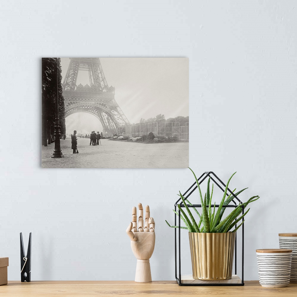 A bohemian room featuring Vintage black and white photograph of Paris in front of the Eiffel Tower on a foggy day.